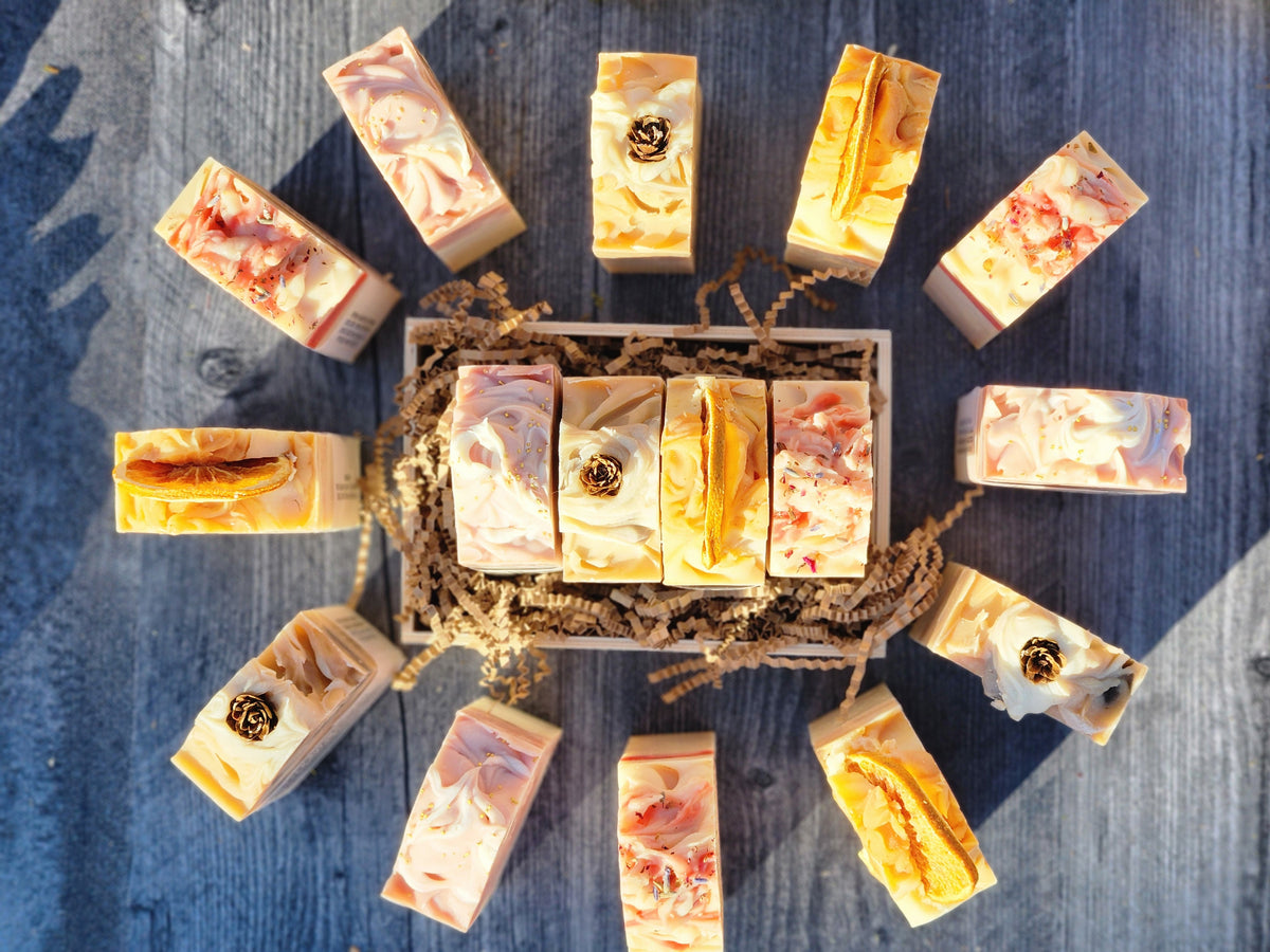 Assorted soap bars arranged on a textured surface